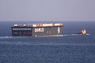 Container ship and Tug