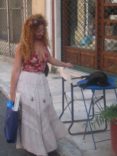 Debbie watches a sleeping cat in Plaka