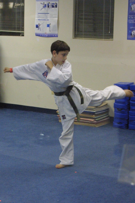 Practicing his side kick