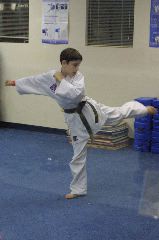 Practicing his side kick